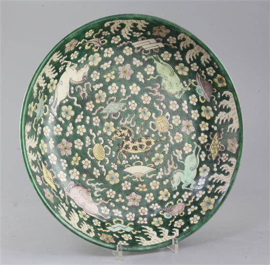 A rare Chinese enamelled biscuit (susancai) nine horses dish, Kangxi period (1662-1722), diameter 32.5cm, slight faults